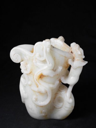 A Superb And Finely Carved Archaistic White Jade Rhyton