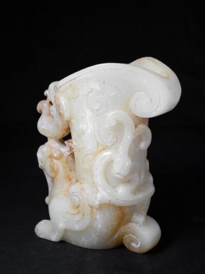 A Rare Miniature Pale Yellowish-Green And Russet Jade Rhyton